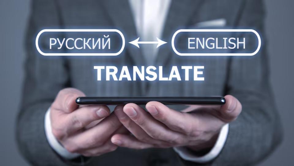  A person in a suit holds a smartphone displaying translation options between Russian and English. TRANSLATE is prominently featured.